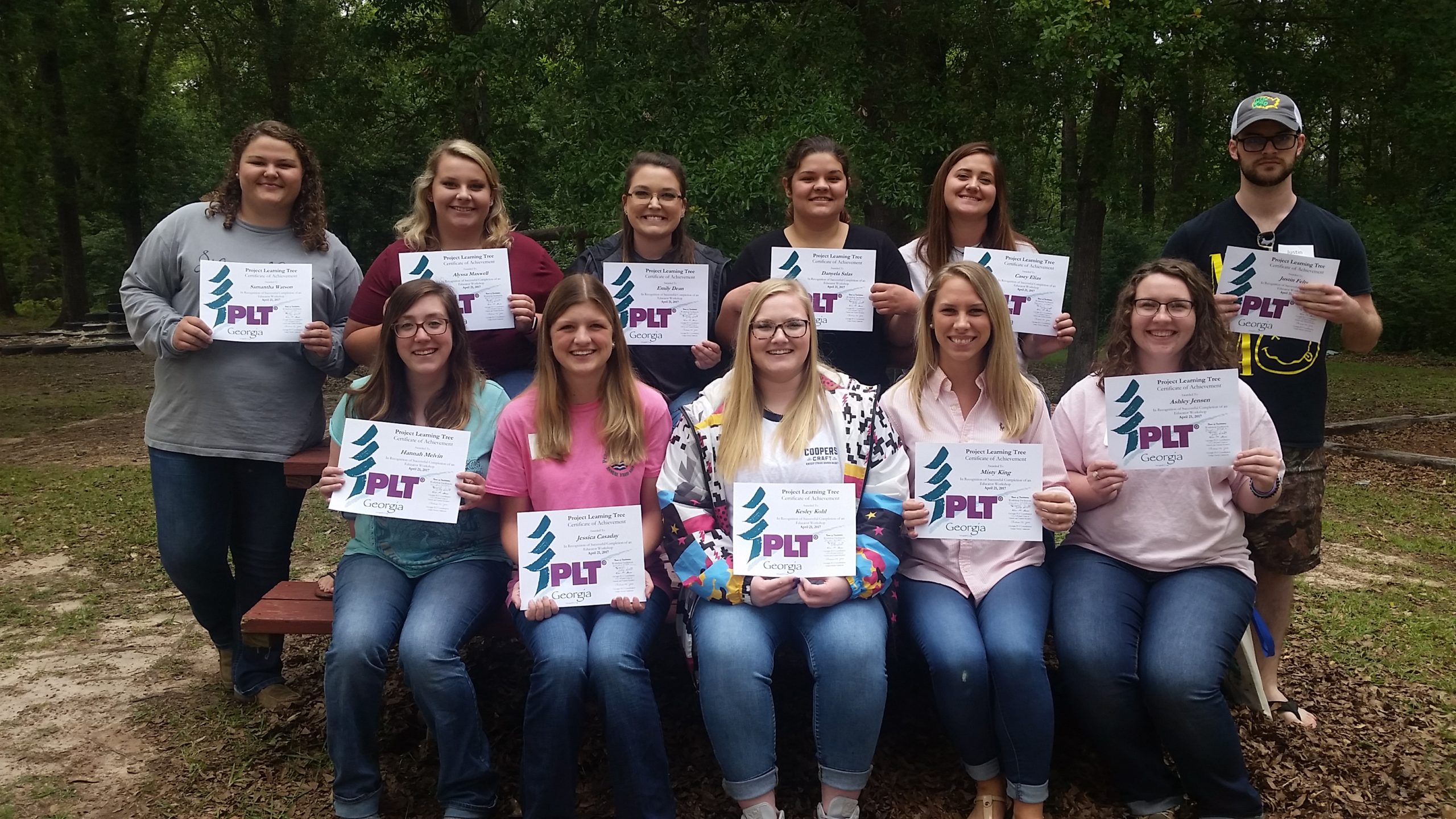 teachers with their certificates