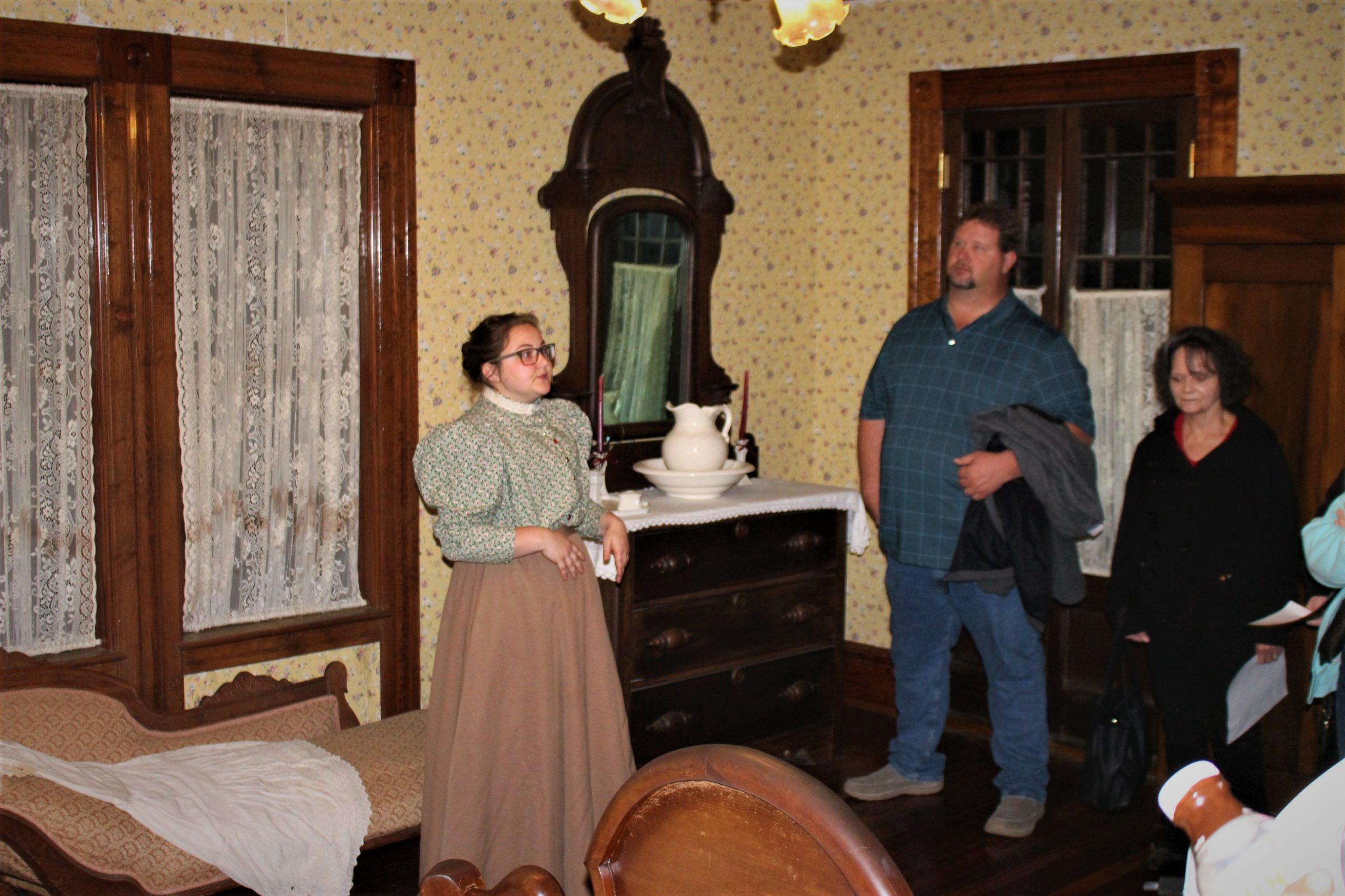 interpreter with guests at the tift house