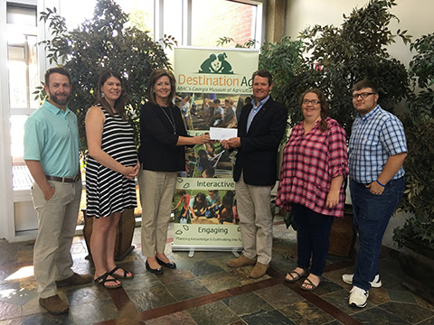 On hand for the Georgia Power donation to the Destination Ag program were (l-r): Garrett Boone and Sara Hand from the Museum, Lynn Lovett from Georgia Power, Wesley Langdale from The Langdale Company, and Kelly Scott and Blaine Holbrook from the Museum.